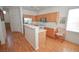 Bright kitchen featuring stainless steel appliances and an eat-in breakfast bar at 6098 Darkfeather Way, Las Vegas, NV 89139