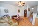 Cozy living room features wood laminate flooring and ceiling fan at 6098 Darkfeather Way, Las Vegas, NV 89139