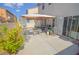 Back patio with partial covering, perfect for outdoor entertaining at 6098 Darkfeather Way, Las Vegas, NV 89139