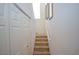 Carpeted stairs lead to the upper level, adjacent to a closet at 6098 Darkfeather Way, Las Vegas, NV 89139