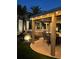 Backyard features a covered dining space, spa, and decorative lighting, perfect for evening entertainment at 6316 Bluejay Way, Las Vegas, NV 89146