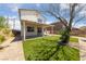 Backyard featuring a covered patio and artificial turf area with privacy at 648 Jumbled Sage Ct, Henderson, NV 89015