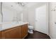 Bathroom with dark wood cabinets and white countertop sink at 648 Jumbled Sage Ct, Henderson, NV 89015