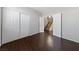 Bedroom with wood floors, white walls, and a closet with sliding doors at 648 Jumbled Sage Ct, Henderson, NV 89015