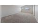Bedroom with gray carpet, white walls, and windows with blinds at 648 Jumbled Sage Ct, Henderson, NV 89015