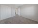 An empty bedroom features plush carpeting, neutral walls, and a closet with paneled doors at 648 Jumbled Sage Ct, Henderson, NV 89015