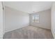 Bedroom with gray carpet, white walls, and windows with blinds at 648 Jumbled Sage Ct, Henderson, NV 89015