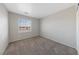 Bedroom featuring carpet, white walls, and window with blinds at 648 Jumbled Sage Ct, Henderson, NV 89015