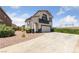 Inviting two-story home with a spacious driveway and manicured landscaping at 648 Jumbled Sage Ct, Henderson, NV 89015