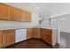 Kitchen corner featuring stainless steel dishwasher and wooden cabinets at 648 Jumbled Sage Ct, Henderson, NV 89015