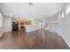 Open-concept living space featuring hardwood floors connecting kitchen and living area at 648 Jumbled Sage Ct, Henderson, NV 89015