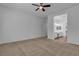 Large bedroom with carpet and open access to the en-suite bathroom at 660 Otter Brook St, Henderson, NV 89011