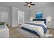 Stylishly staged bedroom featuring a plush bed, artwork, and an en-suite bathroom at 660 Otter Brook St, Henderson, NV 89011