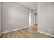 Hallway with wood floors and neutral walls at 665 Look Lively Ct, Henderson, NV 89011