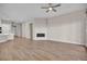 Expansive living room featuring wood-look flooring and a modern fireplace at 665 Look Lively Ct, Henderson, NV 89011