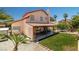 Expansive backyard with a covered patio, lush lawn, and mature landscaping, great for outdoor activities at 6746 Shelter Ln, Las Vegas, NV 89103