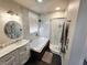 This bathroom offers a soaking tub and separate shower with a modern vanity at 6746 Shelter Ln, Las Vegas, NV 89103