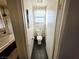 Bathroom featuring modern toilet, mosaic tile wall, and large soaking tub at 6746 Shelter Ln, Las Vegas, NV 89103