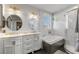 Bathroom with dual sinks, modern cabinetry, and a separate shower and soaking tub at 6746 Shelter Ln, Las Vegas, NV 89103