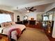 Inviting primary bedroom boasting fireplace, hardwood floors, and natural lighting at 6746 Shelter Ln, Las Vegas, NV 89103
