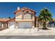 Charming two-story home featuring a stucco exterior, tile roof, and well-manicured landscaping at 6746 Shelter Ln, Las Vegas, NV 89103
