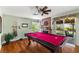 Entertainer's game room with a pool table, fireplace, and access to the backyard patio at 6746 Shelter Ln, Las Vegas, NV 89103