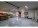 Spacious and organized garage with ample storage, work area, and well-lit epoxy flooring at 6746 Shelter Ln, Las Vegas, NV 89103