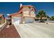 Spacious three-car garage with ample parking space and a well-maintained driveway at 6746 Shelter Ln, Las Vegas, NV 89103