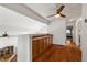 Upstairs hallway with hardwood floors and built-in storage cabinets at 6746 Shelter Ln, Las Vegas, NV 89103