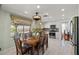 Eat-in kitchen featuring a dining table, stainless steel appliances, and tiled floors at 6746 Shelter Ln, Las Vegas, NV 89103