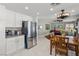 Kitchen featuring stainless steel appliances with dining and entertainment areas in view at 6746 Shelter Ln, Las Vegas, NV 89103