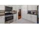 Stylish kitchen with stainless steel appliances and white cabinetry at 6746 Shelter Ln, Las Vegas, NV 89103