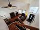Open-concept living space with hardwood floors, plush sofas, and a view of the dining area and front entrance at 6746 Shelter Ln, Las Vegas, NV 89103