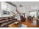 Spacious living room featuring hardwood floors, vaulted ceilings, and an open floor plan at 6746 Shelter Ln, Las Vegas, NV 89103