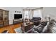 Cozy living room with comfortable seating, hardwood floors, and natural light from large windows at 6746 Shelter Ln, Las Vegas, NV 89103
