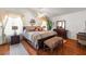 Comfortable main bedroom with hardwood floors, a ceiling fan, and decorative furnishings at 6746 Shelter Ln, Las Vegas, NV 89103