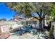 Shot of the backyard patio area with a lush green tree at 6822 Garden Grove Ave, Las Vegas, NV 89103