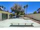 Wide shot of the backyard patio area with mature trees at 6822 Garden Grove Ave, Las Vegas, NV 89103