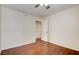 A spacious bedroom featuring hardwood floors and neutral-color walls at 6822 Garden Grove Ave, Las Vegas, NV 89103