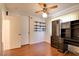 Bedroom showing installed shelving, hardwood floor, ceiling fan, and closet at 6822 Garden Grove Ave, Las Vegas, NV 89103
