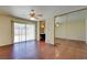 Spacious bedroom with sliding door to outdoor, mirrored closet and hardwood floors at 6822 Garden Grove Ave, Las Vegas, NV 89103