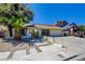 Charming single-story home with desert landscaping, long driveway, and an attached two-car garage at 6822 Garden Grove Ave, Las Vegas, NV 89103