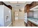 An updated kitchen showcasing modern appliances and tile flooring at 6822 Garden Grove Ave, Las Vegas, NV 89103