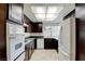 The kitchen features wood cabinets and tile flooring at 6822 Garden Grove Ave, Las Vegas, NV 89103