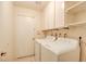 Clean laundry room with washer, dryer and built-in shelves at 6822 Garden Grove Ave, Las Vegas, NV 89103