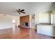 A living room featuring a brick fireplace and a wet bar at 6822 Garden Grove Ave, Las Vegas, NV 89103