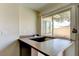 Wet bar featuring a window with a view to the backyard at 6822 Garden Grove Ave, Las Vegas, NV 89103