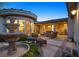 Charming outdoor patio with comfortable seating and a decorative fountain at 69 Tapadero Ln, Las Vegas, NV 89135