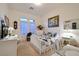 Cozy bedroom with a plush bed, a large window, and stylish decor at 69 Tapadero Ln, Las Vegas, NV 89135
