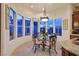 Cozy breakfast nook offers abundant natural light and charming views from a curved window at 69 Tapadero Ln, Las Vegas, NV 89135